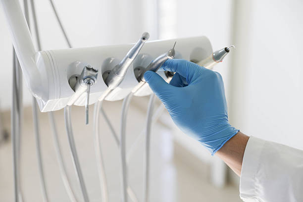 Professional Tooth Extraction technician working in Lovington, IL